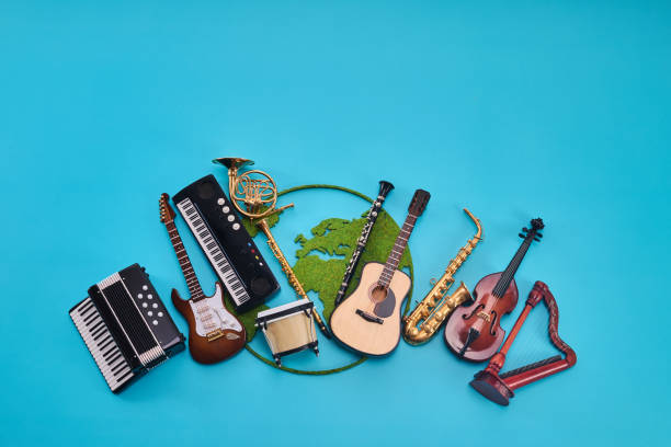 Musikschule Foto von world-music-day-assortment-of-musical-instruments-with-world-map-on-blue-background